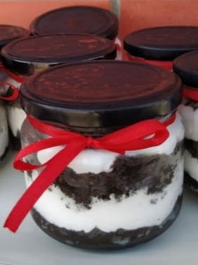 Jar cakes tied with red ribbon